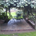 Custom built patio with Brussels Pavers and Copthorne soldier course.
Natural stone wall alongside patio.